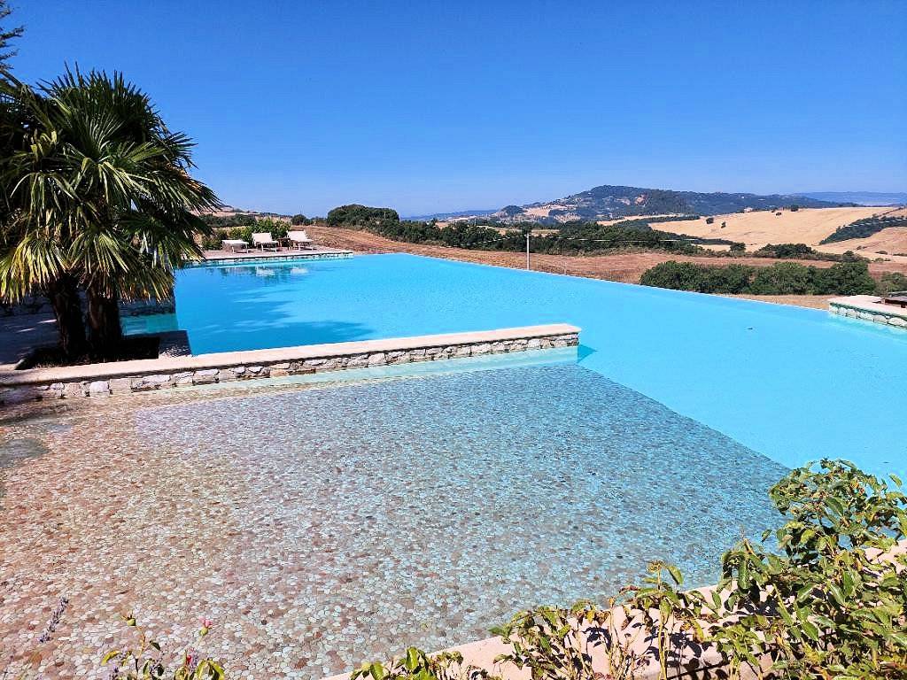 1668-Bellissimo appartamento al piano primo con giardino privato in un borgo completamente ristrutturato con ampia piscina-Volterra-3 Agenzia Immobiliare ASIP